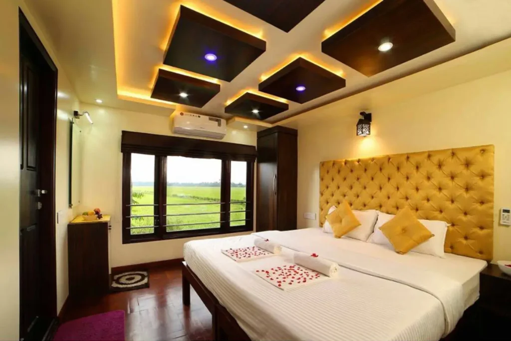 First-time travelers enjoying a Lake Queen houseboat stay in Alleppey, Kerala