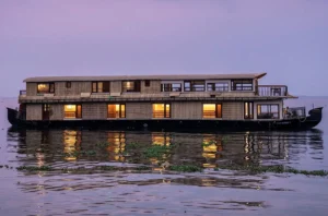 Family enjoying a relaxing houseboat weekend cruise in Alleppey backwaters, Kerala Dining Image